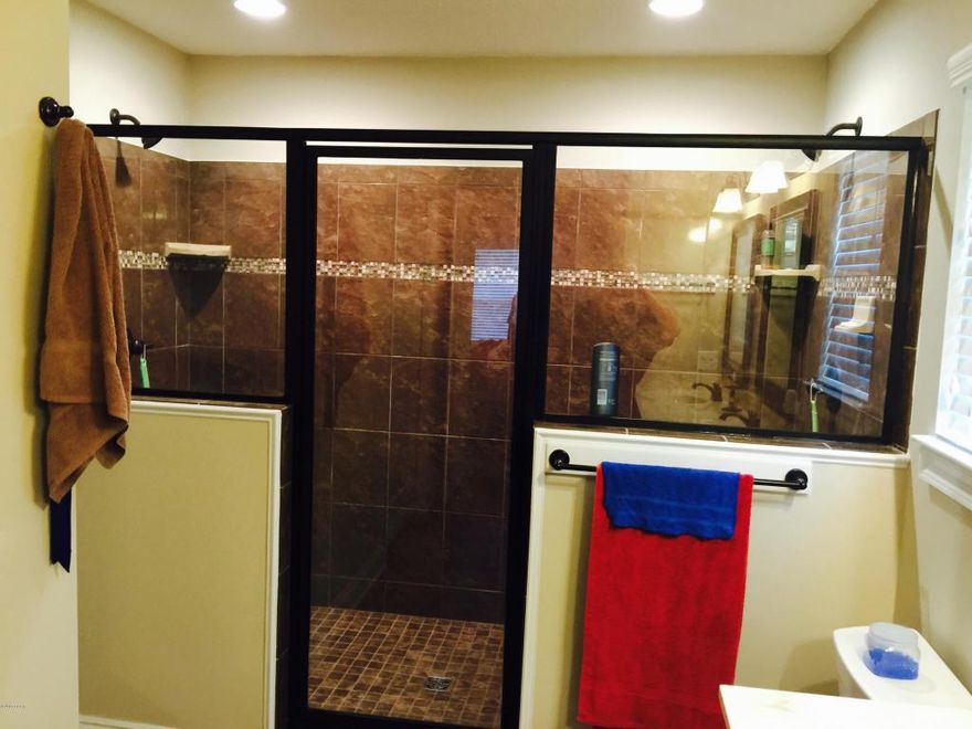 This Custom Built Home Has3 bedroom 2 bath all brick home that offers master bath with his & hers double shower with two heads and shower seats on both ends, and walk in closet. The kitchen is a dream with all wood cabinets, solid surface countertops, and stainless steel appliances. There are cabinets in the laundry room. Living room with and electric fire place and crown molding. Outdoors there is an enclosed screen patio and outside shower, and sprinkler system. Home is built to 130 MPH wind code.