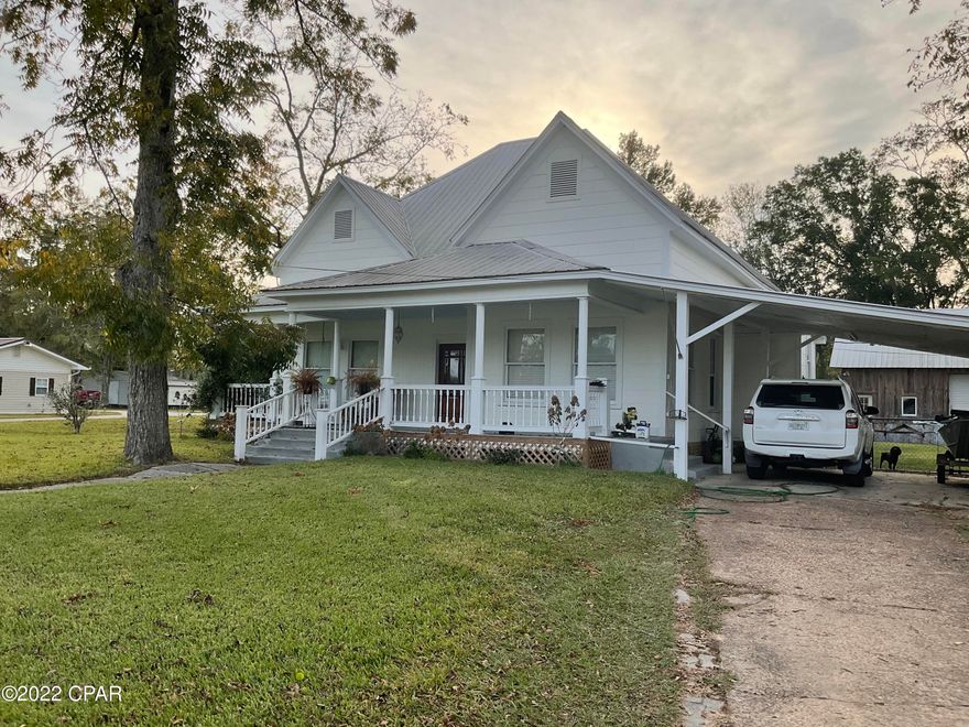 Location location location! This beautiful home with large inviting front porch and situated on over 2 buildable city lots is conveniently located in the heart of Chipley. Back and side yards completely fenced in with chain link fencing. Within walking distance of many conveniences, this home also has an in ground pool, 18'x36', with recent liner and a 2 car detached garage/workshop/man cave, 42'x26', that has concrete floor and upstairs storage. Original hardwood flooring and tall ceilings throughout home with some tile in bathrooms. Kitchen recently updated. The HVAC system is not functioning and will need replacing when new owners take possession.