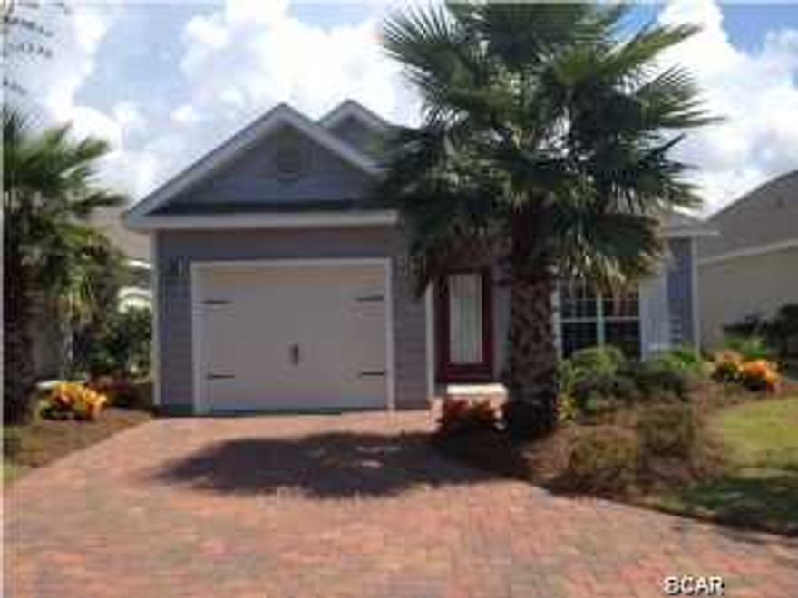 HURRY..This fabulous home in Turtle Cove won't last long! This home is well maintained and features tile floors in entry, dining room, kitchen, breakfast area, pantry, laundry and bathrooms. Kitchen offers stainless appliances, gorgeous maple recessed panel cabinets, under mount sink, breakfast bar and granite counter tops. You will love the open flow of this floor plan. The dining room could also easily be converted to a 4th bedroom. Both master bath and 2nd full baths also have maple cabinets and granite counter tops. A great covered porch, garage, fenced back yard and paver driveway complete this amazing home! Located in Turtle Cove on the quiet west end of Panama City Beach. Turtle Cove amenities include a beautiful lakeside pool with hot tub, clubhouse with a huge community room