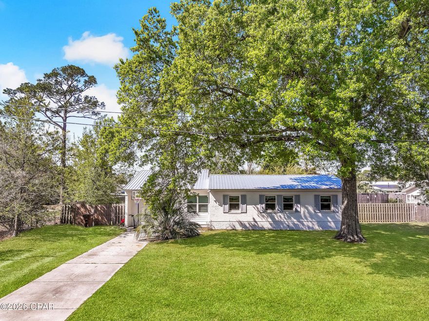 Welcome to this beautifully renovated home in the heart of lovely Port St. Joe! This charming 3-bedroom, 2-bath residence was thoughtfully updated in 2023, featuring all new flooring, modern appliances, and stylishly redesigned bathrooms--offering the perfect blend of comfort and contemporary coastal living. Step inside to find a bright and inviting layout designed for everyday living and easy entertaining. The updated kitchen flows seamlessly into the main living areas, creating a warm and welcoming space for family and guests alike. Outside, you'll love the large yard--perfect for gatherings, pets, or simply enjoying the Florida sunshine. The spacious open back porch is ideal for relaxing evenings, morning coffee, or hosting weekend get-togethers. Located just a short golf cart ride to downtown Port St. Joe, you'll have easy access to local shops, restaurants, and waterfront charm, making this home as convenient as it is inviting. Whether you're looking for a primary residence, second home, or investment opportunity, this property checks all the boxes for coastal living at its best.