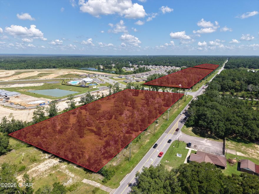 The Woodbine Commercial Assemblage totals +/-22.66 acres across three contiguous parcels of approximately +/-3.34 acres, +/-13.26 acres, and +/-6.06 acres, offering a rare and flexible development opportunity in one of Northwest Florida's fastest-growing corridors. The property features approximately +/-2,821 feet of prime frontage along Woodbine Road, a primary commuter arterial in the rapidly expanding Pace/Milton market within the Pensacola MSA, and includes four hard corners, providing exceptional access, visibility, and design flexibility. The assemblage benefits from strong daily traffic counts of +/-21,709 AADT, ensuring consistent exposure to commuters and local residents alike.

The property is zoned HCD (Highway Commercial Development), is 100% upland, and is in greenfield condition, with all utilities available to the site and an offsite stormwater facility already in place, making it truly development-ready. Situated at the entrance to the 700+ home Lakes of Woodbine subdivision, the site offers an immediate and strong adjacent residential base while also being strategically positioned within a broader high-growth trade area experiencing continued population and employer expansion.

This premier commercial assemblage is ideally suited for a range of retail, office, medical, or service-oriented developments, as well as larger mixed-use or phased projects. With its scale, extensive frontage, multiple hard corners, and location in a thriving suburban market, the Woodbine Commercial Assemblage presents both immediate development potential and strong long-term appreciation upside.

+/-22.66 Acres Total 
Prime Woodbine Road Frontage (+/-2,821') along a primary commuter arterial
4 Hard Corners
Offsite stormwater facility in place with all utilities available
High-Visibility Location with excellent access and exposure
Located at the entrance to the 700+ home Lakes of Woodbine Subdivision, providing an immediate and strong adjacent residential base
Traffic Counts: +/-21,709 AADT on Woodbine Road
Zoning: HCD - Highway Commercial Development