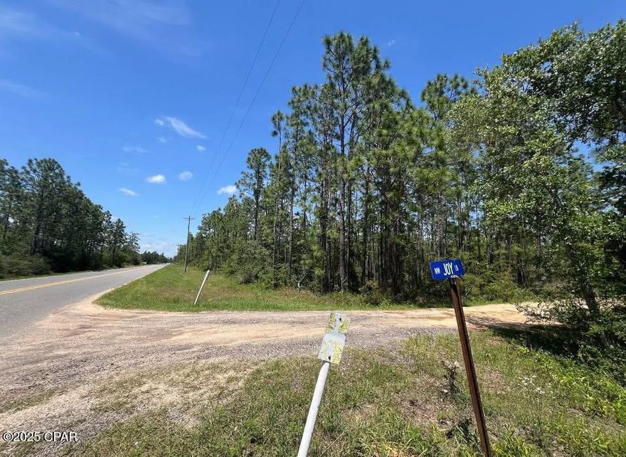 Looking for privacy? Freedom to use your land as you wish? A corner lot that's 5-15 acres? Paved road access with power at the road? You've found it! Close to the beach but still private. All lots are high and dry (not in wet or low areas). Parcel numbers: 03-1N-11-0000-0016-0200, 0300, 0400. Zoned Agricultural 1:1 (1 home/acre). One 5-acre lot has paved access (3974 NW Joy Ln), two adjoin with dirt road access. Under an hour to Panama City Beach, just over an hour to Tallahassee. Min build size is 600 sq ft. Each parcel has an address. No HOA. Well/septic needed. RVs allowed with approval; well/septic required before power; RV living limited to 1 year. No dwelling restrictions. Commercial use possible depending on activity. No full-time living until deed is held. You may prep, clear, build, fence, or camp before deed transfer.