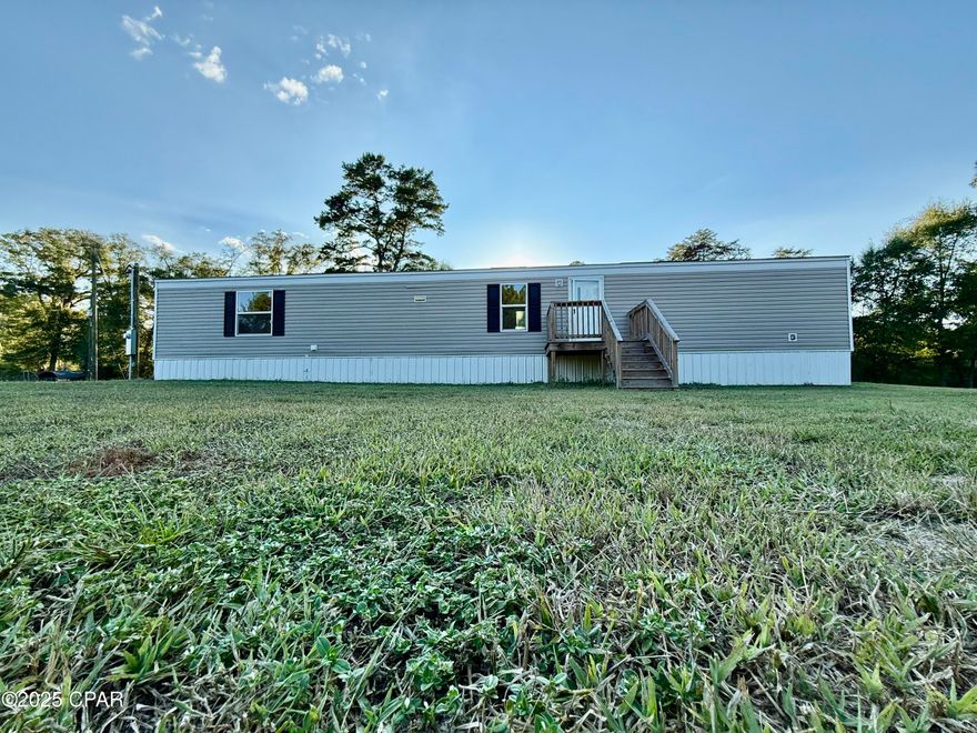 2023 Clayton built, 3 bedroom/2 bath single wide mobile home with large front yard, skirting & porch sitting on 2.05 cleared acres. It is zone II rated for winds and is approximately 902 square feet. The Master bedroom/bath is on one end of the home and the other two bedrooms are on the opposite end.  Two public boat landings are within just a few miles. Recent survey available.