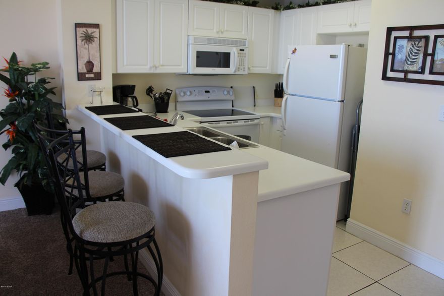 NEW WATER HEATER, NEW A/C,  KABA DOOR LOCK. CELADON BEACH IS LOCATED ON THE MUCH DESIRED WEST END OF PANAMA CITY BEACH. A BEAUTIFUL RESORT WITH ALL THE AMENITIES FOR A PERFECT SECOND HOME OR OUTSTANDING BEACH RENTAL. THIS BEAUTIFULLY FURNISHED UNIT HAS BUILT-IN BUNK BEDS (UNIT SLEEPS 6), 2 FULL BATHS, SPACIOUS LIVING ROOM AND DINING ROOM, 9' CEILINGS, LARGE PRIVATE BALCONY, SOLID SURFACE COUNTERTOPS, WASHER/DRYER, CULTURED MARBLE IN BATHS, COMPLETELY FURNISHED AND READY FOR RENTALS. RESORT FEATURES INCLUDE 283' GULF FRONTAGE, HEATED GULF FRONT POOL WITH SPA, INDOOR/OUTDOOR HEATED POOL, 2 HOT TUBS, TENNIS COURT, MEETING ROOM, MEDIA ROOM, FITNESS FACILITY, 4 LEVEL PARKING GARAGE WITH CLIMATE CONTROLLED WA OVER TO THE LOBBY AND ON SITE RENTAL OFFICE, 3 HI SPEED ELEVATORS AND MUCH MORE....