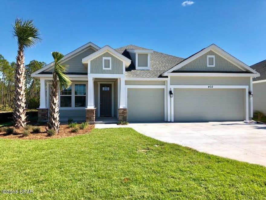 MOVE IN READY....Welcome to luxury in Breakfast Point!  This Samuel Taylor Home features 4 bedrooms, 3 full baths, a formal dining room plus open kitchen, family room and breakfast nook over looking a large covered patio with plenty of green space behind the home and room to add that pool you have always wanted! The kitchen features a Quaker style painted (Avanti White) level 2 wood cabinet with dove tail drawers and soft close doors and drawers, under cabinet lighting, sparkling quartz counter tops, Italian Alps 3 x 12 offset back splash, stainless steel appliances and an over-sized island.  Coretec Plus engineered LVP Blackstone Oak flooring in the main area adds that beachy board walk feel to this already light and bright interior.... The master bath has a large walk in shower with 1/2 glass wall enclosure and Florentine Cararra 24 x 24 tiles on the floor and 12 x 24 on the shower walls.  The main area also has crown molding and window trim to match the doors.  Have a need for storage or a 3rd automobile?  This home can accommodate both with it's light storage above a 3 car garage.  And it's ready and waiting on you!