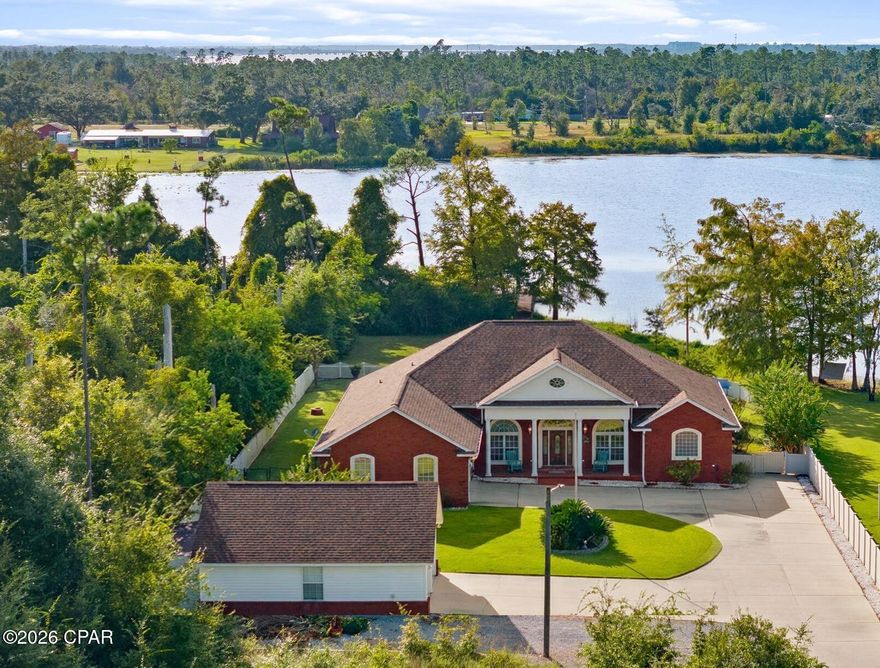 Lowest priced per sq/ft property (under roof) on Deerpoint Lake!!! 

Custom built homes of this quality are incredibly rare in today's market. Take into account that it's perfectly situated on a privately wooded waterfront 1.3 acre lot, it has a gorgeous lake view pool, and that it's been meticulously maintained/complete with all the essential updates... and you won't believe the price on this one!

This awe inspiring 4 bedroom / 3 bath brick home offers over 3,396 square feet of heated and cooled living - and boasts an unheard of 4,335 sq/ft under roof!

From the moment you take one step inside this dream home, you are greeted with breathtaking panoramic water views from nearly every room. From enjoying your morning coffee while watching the sun welcome in each magical new day, to winding down in the evenings and getting lost in your thoughts during some of the most beautiful sunsets in Bay County... this home is a true sanctuary unlike any other.

Custom designed with high ceilings and extensive crown molding throughout, ceramic tile flooring (in wet areas), high end hardwood flooring (in foyer and main walkway), and new carpet (in bedrooms, living room ,and family room), this incredible property is 100% ready for a new family to call it home.

The kitchen is truly a masterpiece of design and quality. Complete with solid hickory cabinets, a gorgeous butcher block island, extensive 2-inch Granite counter tops, durable matching tile back splash, under cabinet lighting, a double porcelain sink, 11' Granite breakfast bar, and a double pantry, this is by far the largest kitchen of all the comps - while also having the best views!

The Florida Room is truly a ''one of a kind'' space that will quickly become the heartbeat of your home. From shooting a competitive game of pool with your friends on the included Brunswick Pool table, to watching the big game and making cocktails at your custom included tiki bar, this room is likely the largest game room on the lake!

When it comes to storing all your toys, the attached oversized garage has 2 large garage doors and high ceilings, and the detached 2 car garage is custom built to match the home, is completely finished inside, and offers extensive attic storage. At the rear of the detached garage is an 8' x 22' enclosed lawn equipment storage area. And just outside is a perfectly positioned RV / Boat storage area with a 50-amp electric plug. Needless to say... this home has EVERYTHING you could ever dream of, plus so much more!

Although this one-of-a-kind home is beyond incredible on the inside, the outdoor space is where it truly separates itself from the rest. The custom designed 20' x 30' inground Gunite pool with waterfall is surrounded with extensive concrete decking, an 8' x 19' retractable awning, and a custom-built stone grilling station. The front 1/4 acre of the property was left natural for absolute privacy, and the remaining greenspace has been meticulously landscaped with lush Zoysia grass, Leyland Cyprus Trees, Sago Palms, Argentine Queen Palms, Crate Myrtle Trees, Oleander Trees, and beautiful Rose Bushes. An extensive vinyl (216') and wood (300') fence perfectly surrounds the property, and a sprinkler system maintains the landscaping beautifully. 

For your lake enjoyment the boat dock consists of a boat slip (without a lift), boat slip with boathouse and lift, 2 wave runner slips, open sun deck, and wood walkway. It is complete with electricity. There is also a fire pit for the cooler time of year. The house is wired and external circuit breaker panel installed for operation of a portable generator for power outages. 

Go look at all the comps, and then come find yourself truly at home. There simply isn't another home that offers this much at this unbelievable price point... Welcome Home.

*A complete list of all the new updates (roof, septic tank, etc) is available in the documents section of the​​‌​​​​‌​‌​​​​‌​​‌​​​​‌‌ listing*