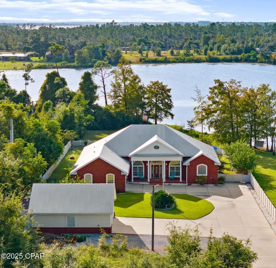 Lowest priced per sq/ft property (under roof) on Deerpoint Lake!!! 

Custom built homes of this quality are incredibly rare in today's market. Take into account that it's perfectly situated on a privately wooded waterfront 1.3 acre lot, it has a gorgeous lake view pool, and that it's been meticulously maintained/complete with all the essential updates... and you won't believe the price on this one!

This awe inspiring 4 bedroom / 3 bath brick home offers over 3,396 square feet of heated and cooled living - and boasts an unheard of 4,335 sq/ft under roof!

From the moment you take one step inside this dream home, you are greeted with breathtaking panoramic water views from nearly every room. From enjoying your morning coffee while watching the sun welcome in each magical new day, to winding down in the evenings and getting lost in your thoughts during some of the most beautiful sunsets in Bay County... this home is a true sanctuary unlike any other.

Custom designed with high ceilings and extensive crown molding throughout, ceramic tile flooring (in wet areas), high end hardwood flooring (in foyer and main walkway), and new carpet (in bedrooms, living room ,and family room), this incredible property is 100% ready for a new family to call it home.

The kitchen is truly a masterpiece of design and quality. Complete with solid hickory cabinets, a gorgeous butcher block island, extensive 2-inch Granite counter tops, durable matching tile back splash, under cabinet lighting, a double porcelain sink, 11' Granite breakfast bar, and a double pantry, this is by far the largest kitchen of all the comps - while also having the best views!

The Florida Room is truly a ''one of a kind'' space that will quickly become the heartbeat of your home. From shooting a competitive game of pool with your friends on the included Brunswick Pool table, to watching the big game and making cocktails at your custom included tiki bar, this room is likely the largest game room on the lake!

When it comes to storing all your toys, the attached oversized garage has 2 large garage doors and high ceilings, and the detached 2 car garage is custom built to match the home, is completely finished inside, and offers extensive attic storage. At the rear of the detached garage is an 8' x 22' enclosed lawn equipment storage area. And just outside is a perfectly positioned RV / Boat storage area with a 50-amp electric plug. Needless to say... this home has EVERYTHING you could ever dream of, plus so much more!

Although this one-of-a-kind home is beyond incredible on the inside, the outdoor space is where it truly separates itself from the rest. The custom designed 20' x 30' inground Gunite pool with waterfall is surrounded with extensive concrete decking, an 8' x 19' retractable awning, and a custom-built stone grilling station. The front 1/4 acre of the property was left natural for absolute privacy, and the remaining greenspace has been meticulously landscaped with lush Zoysia grass, Leyland Cyprus Trees, Sago Palms, Argentine Queen Palms, Crate Myrtle Trees, Oleander Trees, and beautiful Rose Bushes. An extensive vinyl (216') and wood (300') fence perfectly surrounds the property, and a sprinkler system maintains the landscaping beautifully. 

For your lake enjoyment the boat dock consists of a boat slip (without a lift), boat slip with boathouse and lift, 2 wave runner slips, open sun deck, and wood walkway. It is complete with electricity. There is also a fire pit for the cooler time of year. The house is wired and external circuit breaker panel installed for operation of a portable generator for power outages. 

Go look at all the comps, and then come find yourself truly at home. There simply isn't another home that offers this much at this unbelievable price point... Welcome Home.

*A complete list of all the new updates (roof, septic tank, etc) is available in the documents section of the​​‌​​​​‌​‌​​​​‌​​‌​​​​‌‌ listing*