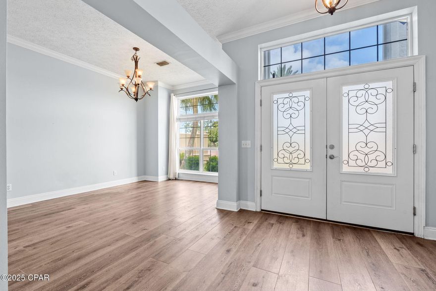 Submit all offers - Motivated to sell quickly. VA Loan Assumable 2.875% Interest Rate. HOA is paid until Jan 2026. Welcome to 2501 Pelican Bay Drive, a beautifully updated 5-bedroom, 2.5-bath home in the Pelican Bay community. This 2,730 sq ft residence features an open-concept layout with high ceilings, new flooring, and fresh paint. The kitchen offers ample cabinetry, updated countertops, and a breakfast bar, ideal for casual dining. The spacious primary suite is on the main floor with a walk-in closet and double vanity. Upstairs includes two bedrooms and a bonus room perfect for a home office or play area. Community amenities include a pool, hot tub, dock, and nature trails. New roof installed. Move-in ready coastal living!