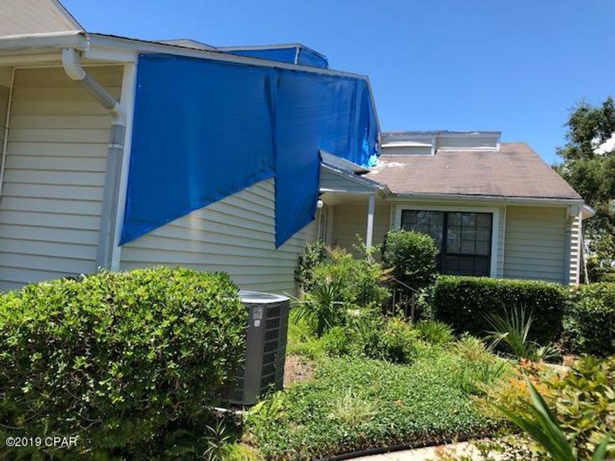 Desirable location to live, Bakers Court Townhouses. Short walk to the shores of St Andrews bay. Master Bedroom actually has a limited view of St Andrews Bay. 2 story, with the only thing upstairs is the guest bedroom and guest bath. Laundry room, powder bathroom and Master bedroom on first floor. Property received some exterior damage from Hurricane, no water intrusion inside unit. Probably needs new roof. Needs new flooring in unit, unrelated to Hurricane Michael. Quiet neighborhood close to St Andrews right off Beach Drive. HOA covers garbage and landscaping and annual power washing of exterior. Garden common area out double back door.