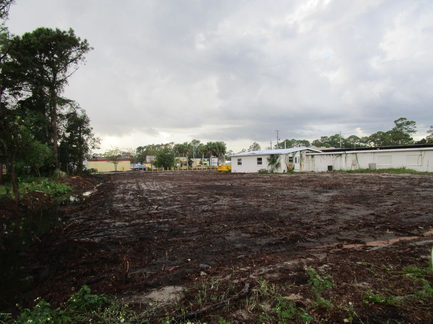 LOT SIZE 157 X 90 * INCREDIBLE LOCATION ON FRONT BEACH ROAD NEAR BRIDGE *  ''L'' SHAPED LOT WITH FRONTAGE ON FRONT BEACH * LOT IS CLEARED AND READY TO GO * DEVELOPMENT ORDER FOR A 6000 SQ. FT. WAREHOUSE IN HAND * PERMIT FOR WATER & SEWER ALSO OBTAINED