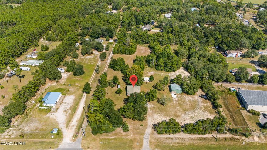 Great Commercial Location on 3.5 Acres on Highway 77. Property has two sheds. Perfect for an Office and Storage yard for Construction Company, Landscaper, Fencing Company, and More. 3 Rooms and Two Bathrooms.
