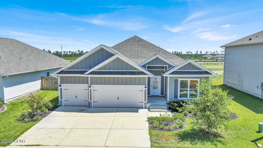 Just Reduced 01.30.2026 to $410,900. Welcome to The Destin, a beautifully designed one-story home offering four spacious bedrooms, three full bathrooms, and a spacious three-car garage, all nestled in one of Panama City's most desirable and growing communities. This thoughtfully laid-out home features a bright and welcoming foyer, leading into an open-concept living space perfect for both entertaining and everyday living. The gourmet kitchen is the heart of the home, complete with stainless steel appliances, large walk-in pantry, and a central island with a sink that keeps you connected to the living and dining areas. Just off the kitchen, the breakfast nook offers natural light and a custom-built desk area that matches the kitchen cabinetry—ideal for working from home or managing household tasks.

The split-bedroom floor plan ensures privacy, with two guest bedrooms and a full bath at the front of the home, and a third guest bedroom with its own full bath tucked away at the rear. The private primary suite is located in the back corner of the home and features tray ceilings, a luxurious bathroom with double vanities, a glass-enclosed shower, a garden tub, and a large walk-in closet. High 9-foot ceilings throughout the home add to the spacious and airy feel, while luxury vinyl plank flooring in the main and wet areas provides both style and durability. All bedrooms are carpeted for added comfort.

This home also includes a fully sodded and professionally landscaped yard, privacy fenced-in rear and side yards, an extended driveway, and a community pool and playground just steps away. With a prime location just off Highway 390, you'll enjoy quick access to shopping, dining, medical facilities, and top local attractions. Publix is just two minutes away, while Downtown Panama City, Gulf Coast Medical Center, Tyndall Air Force Base, and Panama City Beach are all within easy driving distance.

This move-in ready home combines comfort, elegance, convenience, and quality in one of the area's most sought-after neighborhoods. Schedule your private tour today and discover all that The Destin at Titus Park has to offer.