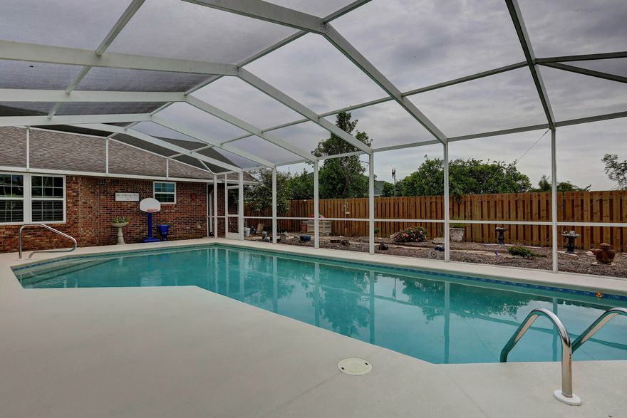 HUGE, BEAUTIFUL BACKYARD, with screened pool! Plenty of room for a garden, volleyball, soccer practice, all which can be viewed from either the screened porch, the heated and cooled Florida Room or the kitchen!  Like most homes in Bay County, the following are new: roof, windows, hardiboard siding, hurricane strength garage door, pool enclosure, sprinkler system. The salt water pool has been resurfaced and is perfect for swimming laps. There is a separate water meter for the sprinkler system and the back fence has a double gate allowing access from Harvard Blvd...great for parking a small boat or trailer. The garden shed is wonderful for organizing your planting needs. With the pavered terrace, that includes a grilling area and beautiful natural landscaping, you will be spending a lot of time outside! The front porch is long with plenty of room for rocking chairs! Entering the foyer, there is a half bath for guests, a coat closet, and on your left there is a spacious formal living room that opens to the formal dining room. Beyond the foyer is a large family room with a real, brick-built fireplace with a mantel and it is flanked by built-in bookshelves. These areas, plus the breakfast nook, all have gorgeous plantation shutters.
The kitchen has lots of cabinets with glass doors that make a nice display for your dishes. Solid surface countertops, smooth-top stove, appliances all under 5 yrs old, breakfast bar and a big walk-in pantry, will make any cook happy!
The laundry room has a ton of space! Enough room for the washer, dryer and freezer (that all convey), plus a sink and built-in cabinets! The large MBR has access to the Florida room, which takes you to the pool for late night swims after the kids are tucked in bed! The MBA has a sep shower, whirlpool tub with decorative tile, dbl vanity with lots of storage, a water closet and a huge walk-in closet with a closet system built-in.
The other 3 bedrooms are all a good size and 2 of them have walk-in closets.  The hall bath has a dbl vanity, plus a knee space to sit and do hair and makeup.  On this hallway there is more storage closets! The A/C is less than 5 yrs old.  The garage has attic access and an area for a workshop.  The neighborhood is like the old days, where you speak to one another and help each other in times of crisis, like Hurricane Michael! No where I would rather be!  Age, sq ft, room sizes, lot size are all estimates. please measure if concerned.