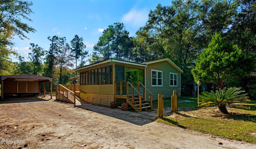 This is a very clean 2 bedroom 2 bath move in ready mobile home nestled on an oversized lot in the tranquil setting of Bunker Creek. This very quiet community is an outdoorsmen's dream with plenty of hunting and fishing nearby. This small community is a hidden gem in Walton County but also conveniently located 30 minutes from the beach and Pier Park. This spacious home is perfect for family gatherings and entertaining with its open concept living space with fireplace and large front screened in porch. The master suite features 2 walk in closets, a garden tub, separate shower and a screen porch off the master with outdoor shower. There is also an 11x16 workshop equipped with power and water. ac/ roof replaced in 2017. Brand new 6000 dollar Culligan water filtration system.