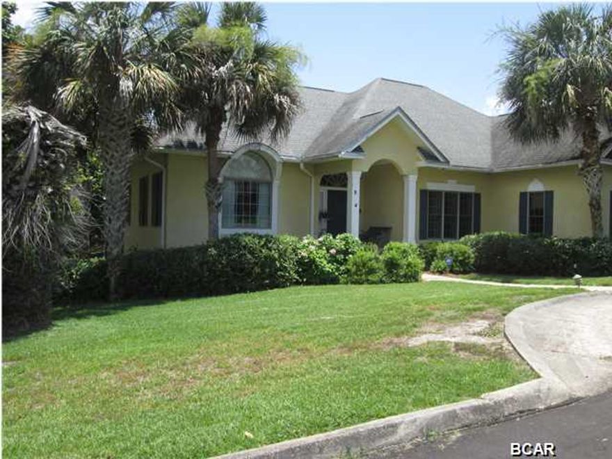 Nestled alongside Lake Powell, one of the largest coastal dune lakes in Florida, your dream home awaits you!!!! From your screened-in porch, have your breakfast or dinner while enjoying the serene view of the Lake. Your home offers unique features throughout...a formal living room, a formal dining room, dinette area off the kitchen, family room with wet bar, 2 fireplaces, View of the water from family room, formal living room, master bedroom & screen porch. 3 bedrooms downstairs, bonus/office or 4th bedroom upstairs, Master Bedroom with TWO bathrooms - one for him and one for her!!!, laundry room w/1/2 bath, trey ceilings w/ceiling lighting, a large pantry & attached 2 car garage are just a few of the features within your home. The Private Gated Community offers a community boa dock with access to Lake Powell where you can enjoy jet skiing, boating, fishing, etc. Close to Pier Park, Frank Brown Park, and 30A. Overlooking Lake Powell and just Blocks to the Gulf of Mexico.....This is truly the best of Both Worlds!!! LISTING IS ONLY FOR LOT 5, LOT 4 MAY BE PURCHASED WITH SAID PROPERTY (LOT 5) AT AN ADDITIONAL PRICE AGREED UPON BY SELLER AND BUYER.