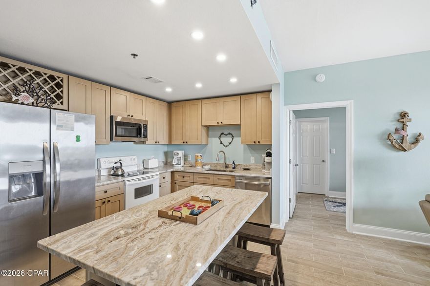 A must see completely remodeled 3-bedroom 2 bath unit at Laketown Wharf. This unit has a new HVAC 2023, New water heater & pressure reducer valve 2025, Updated soft close cabinets 2025, new granite 2025, beautiful cabinetry in bathrooms, new furniture, new drapes, leather couches, new file flooring, new sinks & toilets 2025, new fridge 2024, new dishwasher & dryer 2023, new master bedroom mattress 2025, Moen Flo leak detection and remote water shut off system, balcony polywood furniture 2024.  A must-see vacation rental, second home or permanent home. Laketown Wharf is a unique mix of condominiums, 5 pools, fitness center, hot tubs, lake, boardwalk, restaurants, shops and a 30,000 SQFT arcade, bowling alley, entertainment venue. Don't miss an opportunity to be a part of this unique resort located directly across from the Gulf and world-famous Pineapple Willys.