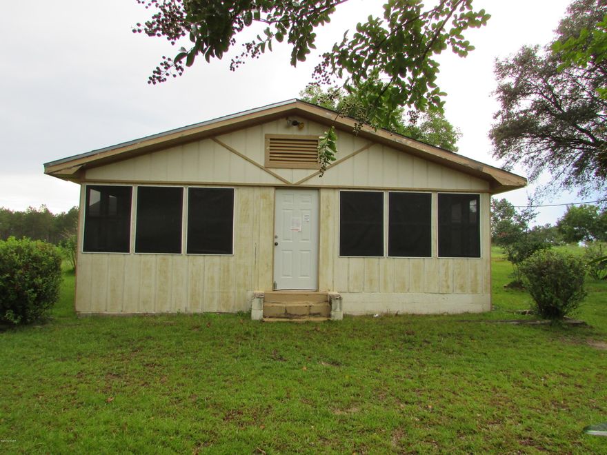 Large Home located in Bonifay!! 2 Bedroom 2 Bath home with 1790 sq ft under air. Located on 2.50 acres! Central AC, Screen Porch, Deck, Storage building. Home needs some TLC. Call for further information!!