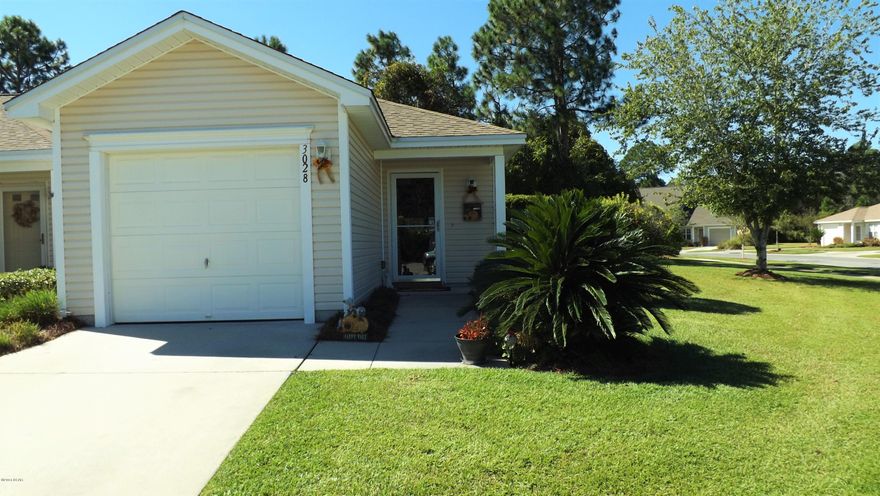 Highly sought after end unit townhome in the Hammocks subdivision.  This immaculately maintained home is a must see.  Home features an open floorplan great for entertaining with a screen porch and large side yard maintained by the homeowners association.  The Hammocks is centrally located convenient to shopping and features a community pool and clubhouse.  Call you Realtor today to see!