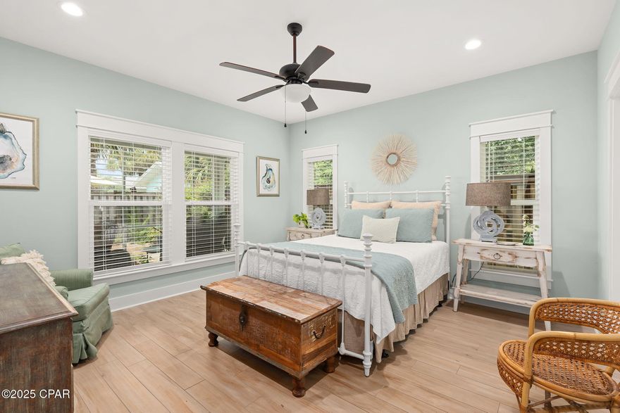 Coastal luxury meets thoughtful design. Custom Built by renowned local builder Tom Ledman, this professionally designed 2-bedroom, 2.5-bath home is straight out of Southern Living Magazine. Featuring 9-ft ceilings and tile flooring throughout, every inch of this residence reflects timeless elegance and relaxed beach living.
The spacious open-concept layout includes a large, beautifully designed kitchen with ample cabinetry, generous counter space, and a dedicated dining area—perfect for hosting friends or enjoying quiet meals at home. Entertaining flows effortlessly into the bright living area and out to the screened-in porch with ceiling fans, paver patio, and outdoor shower.
The primary suite features a walk-in closet and spa-style bathroom with a large walk-in shower and a heated exhaust fan. The second bedroom also has its own private en-suite with a deep jetted soaking tub and built-in heater fan for added comfort. Guests enjoy a separate half bath, offering privacy and convenience.
Additional highlights include a fully finished, drywalled garage, full gutter system, and professionally selected finishes by a renowned interior designer. This home is move-in ready and ideally located less than 1 block from the white-sand beaches.