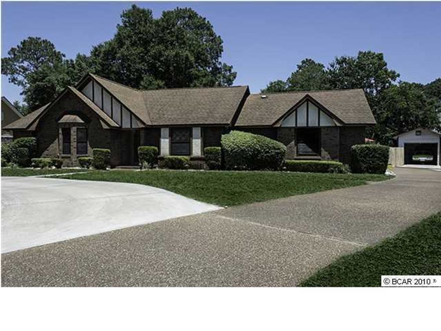 KINGS POINT HARBOUR ... much sought after neighborhood of fine homes in Panama City, FL.  Location, location, location!  Custom built brick home situated on large lot.  4 BR/2Bath ... split BR floor plan ... in ground pool ... 9' deep ... nearly new liner with 20 year warranty ... new pump and Polaris pool equipment.  Hot tub on back porch is negotiable.  Entry door with leaded glass and foyer area reflect the friendly spirit of this home.  Seller is using separate formal LR as a game room ... tastefully done ... pool table and wall mounted TV area negotiable.  Large formal dining room adjacent to kitchen and breakfast area large enough for a group or can be used for intimate candlelight dinners.  Great room with wood burning fireplace for those cool winter nights brings brings such warmth to this home.  These rooms have beautiful oak hardwood floors.  Kitchen has been updated with granite counter tops, stainless steel appliances and some reconfiguration of walls/cabinets in order to be opened up to large great room.  Great for parties ... cook never gets left out!  Home has active security system to include a fire alarm.  There is attached 2 car garage and detached 1 car garage/workshop.  Jack & Jill bath between 2 of the additional bedrooms with skylight.  Two water meters - separate for sprinkler system.  All measurements should be verified for accuracy.