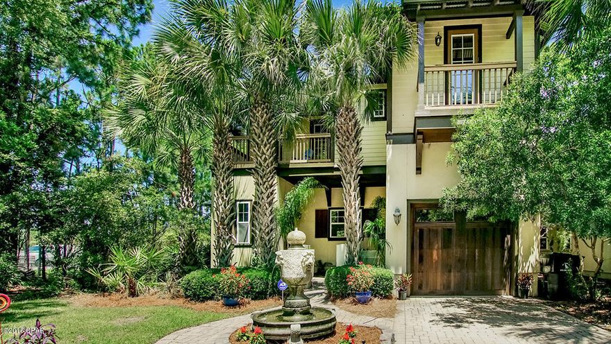 Old Florida style home with a great lake view and courtyard entrance. Brand new engineered hard wood flooring, new landscaping, and the majority of the down stairs has been and freshly painted throughout the home. Owners installed a gated aluminum fencing encompassing the whole back yard as well as up the side of the house. This home features an open kitchen with a large island kitchen, granite counter tops, custom cabinets, walk-in pantry, and stainless steel appliances. It opens up to the living and dining area. The living room has hardwood floors and a breakfast bar. The large covered porch wraps the living room with two sets of French doors. A large master suite with a private balcony is upstairs with a master bath with double vanities, a garden tub, and walk in closet. Two additional bedrooms, a bunk hall, and two additional balconies. This home is a must see!