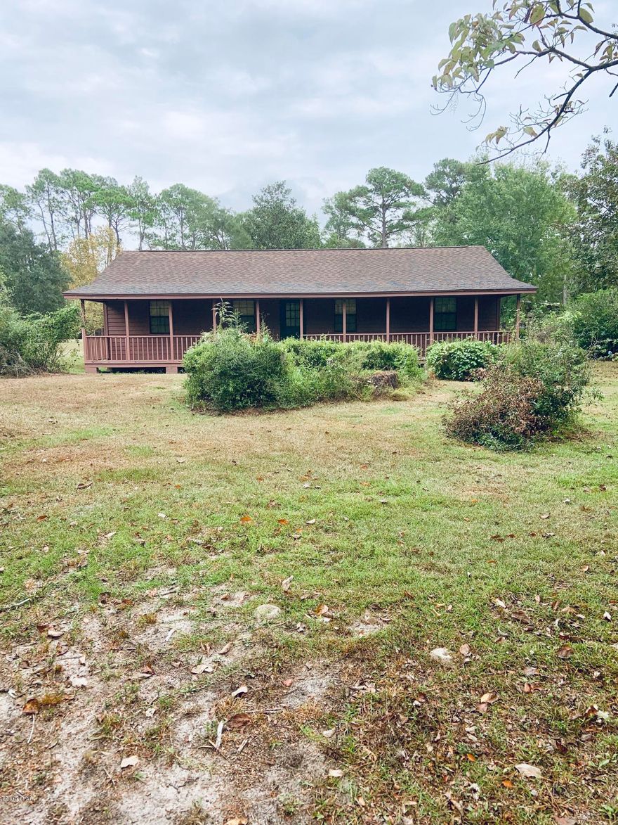 HARD TO FIND 3 BEDROOM 2 BATH HOME SITUATED ON 3.66 ACRES CONVENIENTLY LOCATED  JUST MINUTES FROM TOWN! TWO SHEDS TO KEEP YOUR TOYS OUT OF THE WEATHER! BEAUTIFUL SHADE TREES, AS WELL AS GREAT PRODUCING BLUEBERRY BUSHES AND GRAPE VINES! AMAZING PORCHES FOR YOUR ENJOYMENT! CALL TODAY FOR YOUR CHANCE TO VIEW!