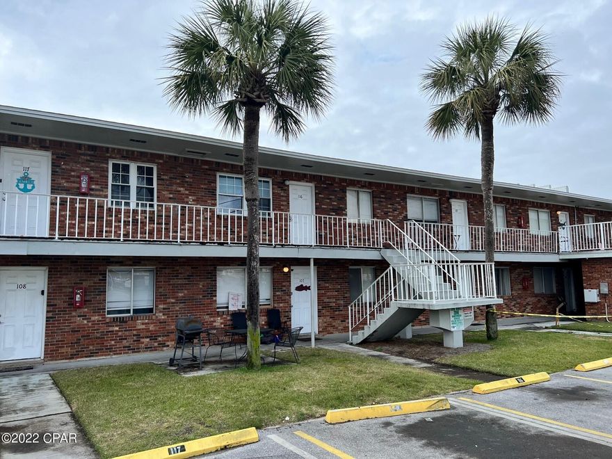 Turnkey condo ready for you or your tenants! Newly painted two-bedroom condo conveniently located right off Thomas Drive. New A/C installed in 2020. Beautiful hardwood floors throughout entire unit, with the exception of the tiled bathroom. Within walking distance to the beach and just 1.5 miles from St. Andrew State Park. It is a short walk to shopping, restaurants, and Pirate's Cove Marina. This condo is ideal for a primary residence, a second home, or investment property. Short or long term allowed. $200 a month HOA; includes: lawn maintenance, garbage, water, sewer, cable and insurance on the building.