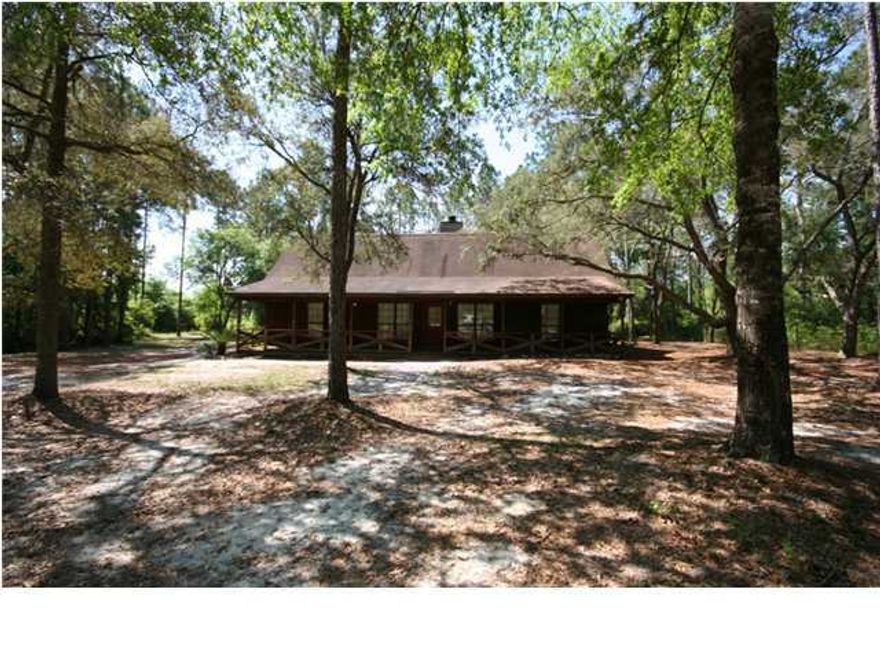 This home is situated on 5 Acres, just short distance to Deerpoint Lake. Home is Cedar exterior, split floor plan, porch across the front of the home and oversized storage garage in the back. Great Room with vaulted ceiling, master bedroom with private bath, formal dining room, eatin kitchen with bay window, tiled family room and large laundry room accessing the back deck. Call for your appt today. Seller is motivated, bring and offer.