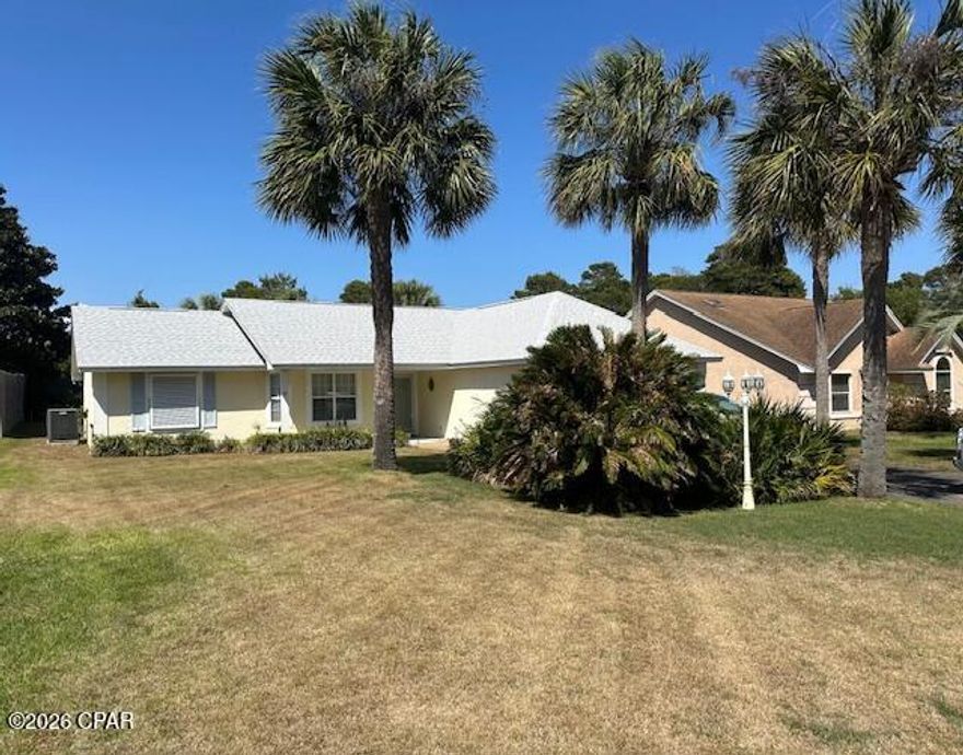 Welcome to your slice of paradise on the desirable west end of Panama City Beach! This  3-bedroom, 2-bath home sits S of Hwy 98 on a rare .25 acre lot, a short stroll to one of Bay County's quietest beach access. Offering the perfect blend of comfort, convenience, and coastal charm with NO HOA and short term rentals approved. Step inside to a thoughtfully designed split floor plan, providing privacy for the spacious primary suite, complete with an en suite bathroom and a generous walk-in closet. The additional bedrooms are well-sized and ideal for family, guests, or even a home office. Enjoy peace of mind with major updates already taken care of--new HVAC, water heater, and roof all installed in 2022. The home also features a screened-in back patio, perfect for relaxing mornings with coffee or unwinding in the evening while enjoying the Florida breeze--without the bugs. Located just minutes from the sugar-white sands and emerald waters, as well as dining, shopping, and entertainment, this home is ideal as a primary residence, vacation getaway, or investment opportunity. All measurements are approximate. Don't miss your chance to own a home in one of the most sought-after areas of Panama City Beach!