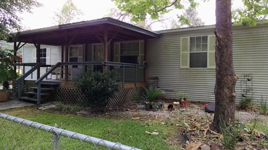 Very nice double wide for that first time home buyer on for a rental. Located on the out skirts of town, very nice neighborhood,quite and kind of secluded. Has large covered front porch, with lots of shade. Double car carport and storage building. Inside features large open floor plan, with big living room. Kitchen is open to living room with a bar in between. With 3 bedrooms and two baths, lots of room for a family. Move in ready, make an appointment to see today.