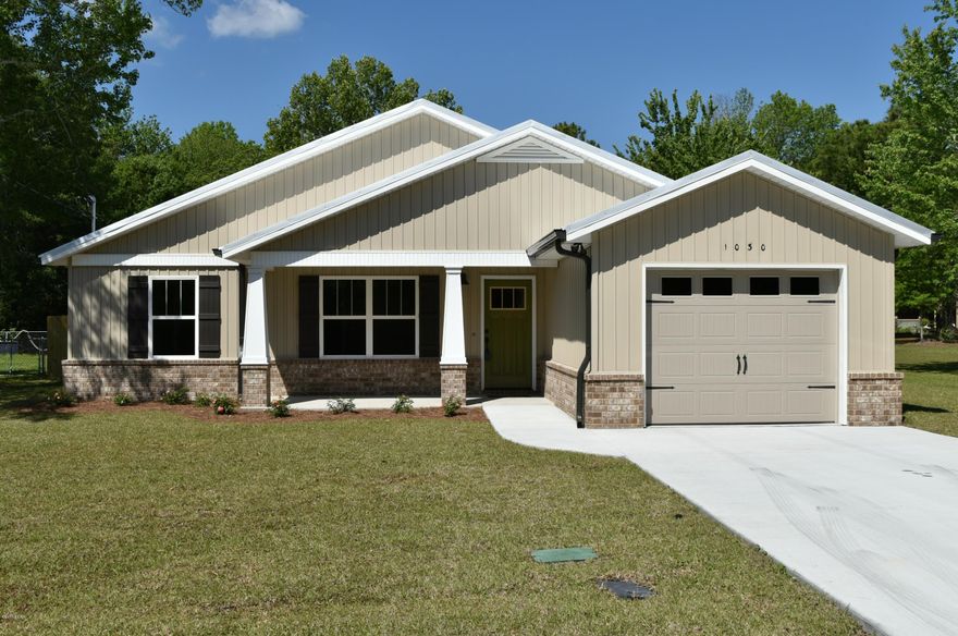 Callaway ... 3/2 Custom Built Craftsman Style home with 1,540 SF.  Located near East Bay, shopping, dining, schools, and only 4.9 miles to Tyndall Air Force Base.  Custom features include:  Low maintenance Tuff Rib metal roof ... entire yard sodded with auto sprinkler system ... privacy fenced back yard ... covered back porch.  City water, sewer & garbage.  Custom doors to include pocket door in M Bath ... all Delta sink/bath/shower accessories.  Kitchen ... stainless Whirlpool appliances ... wood cabinets ... soft close drawers.  Counter tops Grade A granite ... all from same slab.  Entire house has porcelain wood tile floors. Don't miss the large laundry room w sink & granite counter top.  Compare to the rest ... only build one house at a time ... quality home at its finest!