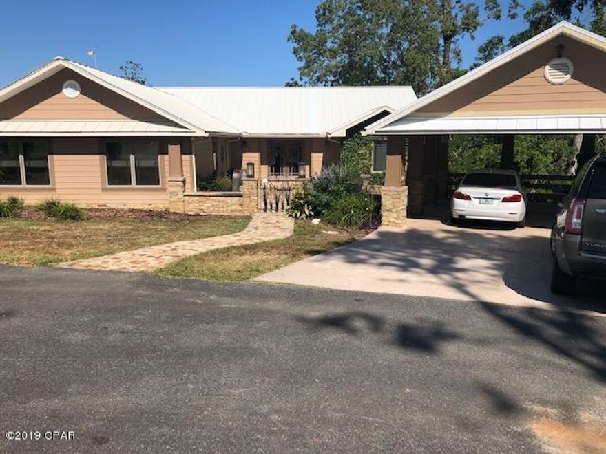 A modern home siting on the bank of Chipola river with a view of the Dead Lakes.  The south's finest shell cracker fishing.  Pella windows with an abundant amount of views.  Sitting area by the dining room make a peaceful locationfor an early morning sunrise.
