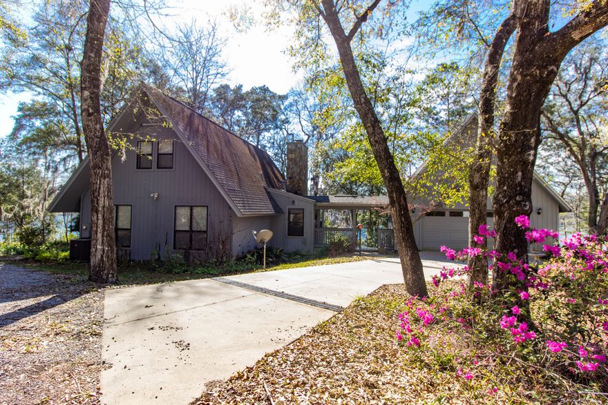 This is a Lake Home - NOT a Lake Cabin. Look at the pictures under the Photos tab NOW! Take the Video Tour while you're in the Photos tab. Drive for only 30 Minutes north of Lynn Haven and you will be in Paradise, literally. Paradise Lakes Community. Immaculate Lake Home built for family living. Lovingly taken care of by the original and only owners. Built with quality and duration in mind. 4 Bedroom/3 Bath Main House with a 1 Bedroom/1 Bath Studio Apt Carriage House over the large attached Garage. Sits on 1 1/2 lots with boat dock. Community boat ramp. Awesome fishing lake. You will want to be in Paradise forever, just like the owners. Easy to show. Ask your Realtor to ''Take You to Paradise''. (All information and dimensions are estimates and should be verified by the buyer if important.