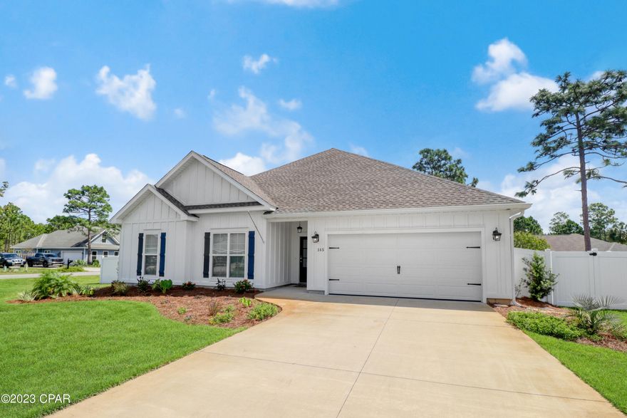 Located just a golf cart ride away from downtown shopping, dining, and entertainment, this residence offers convenience and comfort in one beautiful package. As you step inside, you'll be greeted by the gorgeous hardwood floors that flow seamlessly throughout the living space. The centerpiece of the living area is a beautiful gas fireplace, complete with a custom mantel, creating a cozy and inviting atmosphere for gatherings with family and friends. The thoughtful layout ensures that the master bedroom is separate from the guest bedrooms, allowing for privacy and relaxation. This design is perfect for those seeking a peaceful retreat within their own home. In the kitchen, discover granite countertops, a kitchen island, and a welcoming breakfast nook. These features make meal preparation a breeze, while the island offers extra counter space and seating for casual dining or entertaining. Step outside to a spacious screened porch, the perfect spot to enjoy the coastal breeze and soak in the serene surroundings. The beautifully fenced and landscaped backyard adds a touch of natural beauty and provides a sense of tranquility. This open-concept home effortlessly combines style, functionality, and accessibility, offering you the ideal Port St. Joe lifestyle. Whether you're enjoying the hardwood floors, the warmth of the gas fireplace, or the outdoor oasis, this home truly has it all.