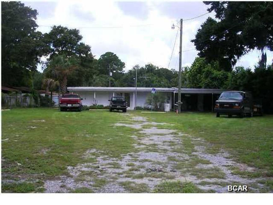 Nice mixed use property fronting Chestnut Avenue with potential for a variety of uses.The main structure is an open, air conditioned workshop with power throughout the space. Plus in the middle of the shop carry 50 amps of power and three phase is run to the building. There is also an attached, enclosed garage. Property being conveyed is located within the fenced area.