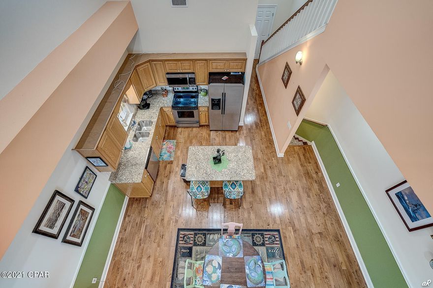 UNDER CONTRACT WITH CONTINGENCIES; SELLER ACCEPTNG BACKUP OFFERS.

Look no further.  This home is a bargain deal at $749,000 where homes south of Thomas Drive exceed $1 million.  

NO HOA!  SHORT TERM RENTALS ALLOWED!  This home has that WOW factor from the moment you walk through the door!

This 4 bedroom / 2.5 bathroom home has it all including Gulf views from the 2nd and 3rd floor balconies.  Brand new roof installed June 2021.  New HVAC units (one replaced in 2019, and the other replaced in 2020).  Brand new, large spa/pool was just installed in the backyard. The backyard is an absolute paradise with hard surface pavers and over 400 sq feet of entertainment space with extra storage.
The home has an elevator that makes it convenient to get up and down to multiple floors.
Downstairs there are 3 bedrooms and two full bathrooms, granite countertops, and custom vanities.  The laundry area is also on the first floor (no trips up and down stairs for laundry). 
The second floor has a large master bedroom, master bathroom, with separate water closet and separate shower. 
The large, great room has beautiful hardwood floors, high raised ceilings, and recessed lighting.  The kitchen has all stainless steel appliances, and a large kitchen island with granite countertops.  
This home would make an excellent primary residence, second home, or investment/rental property.  
This home includes an office with a kitchenette and built-in bookshelves, a one car garage, and extra locked storage.  The 3rd floor has a is a huge loft which could be considered the 4th bedroom, a game room, or entertainment space. This home is being sold furnished (which the exception of a couple of small items).   Since the home is on the south side of Thomas Drive, you don't have to worry about crossing a four-lane road to get to the beach access which is literally 90 steps from your door!