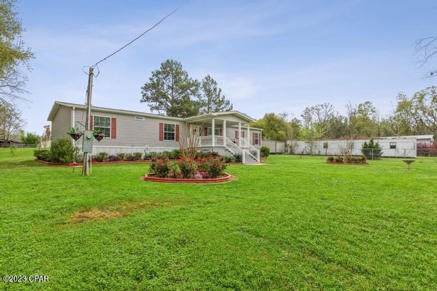 Come see this beautiful move in ready 2019 home and landscaped yard just 2 miles from Hwy 231 and I-10  in Cottondale, FL. This 4/2 1904 sq ft home sits on 1.1 acres. This split floor plan will allow for you to entertain guest as you enjoy the above ground pool in the Florida summers. Beautiful back covered deck with wheelchair ramp. You got to come see this place and make it yours today.  The house is surrounded by a chain link fence an attached carport and shed. At the back of the property is a great Pole Barn and so many fruit trees to enjoy.  In season the chain link fence is covered in roses.  Seller is very motivated. 



All measurements are approximate and from propertyappraisers website. Buyer to verify.