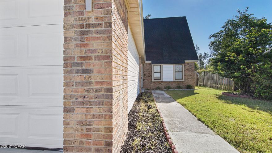 Financing fell through, Back on the Market.  GREAT HOME NEAR TYNDALL AFB! New interior paint. This home features 3 bedrooms, 2 full baths, an upstairs loft, an open concept and an attached garage. The kitchen has attractive countertops, white appliances, and a subway tile back splash. The sunken living room is open to the dining area and has beautiful flooring (no carpet in this home). The master bedroom is downstairs and has an adjoining bath with tile floors and a stand up shower. Upstairs has 2 bedrooms, a hall bath and an open loft. The exterior has an enclosed back patio with tile floor, a new roof in 2019 and a  privacy fenced backyard. This home is located in a popular neighborhood and has a nice set up for entertaining.