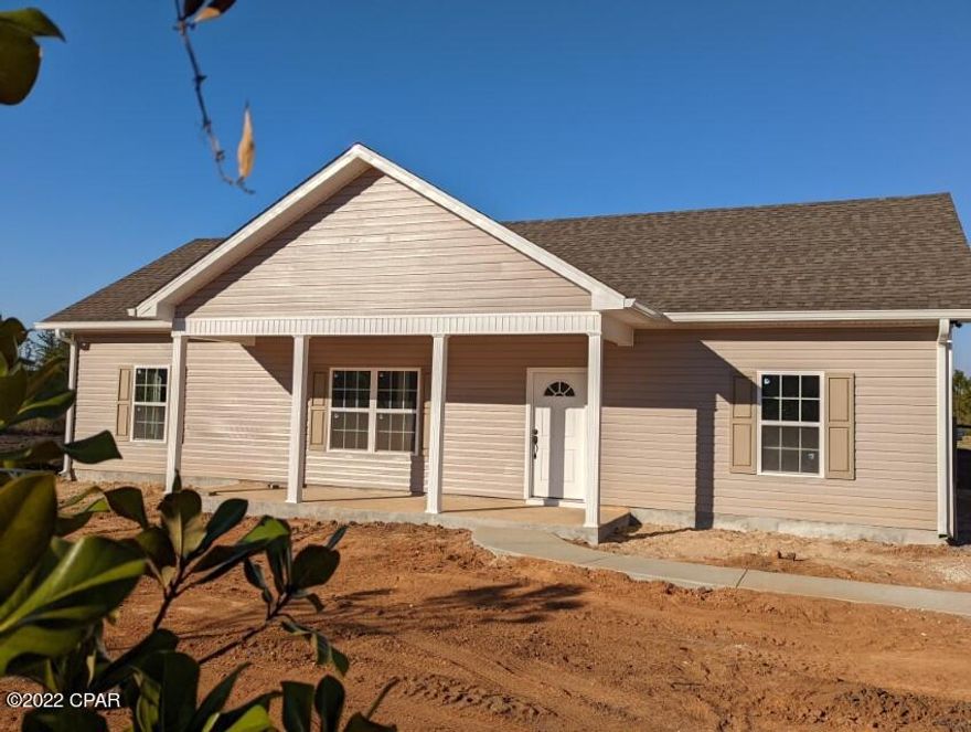New Residential Home, no-HOA, Marianna Florida, lot size less than one acre easy to maintain, space for backyard parking, 3/2, 1456 sqft Home built 2022 - currently in final stages of completion. Home consists of nice open spaces, kitchen breakfast bar, white cabinets with self-close drawers, flooring baseboards, trey ceiling living area and master bedroom, beautiful vinyl exterior siding, interior/exterior natural tone paint colors. Walk in closets, vinyl wood style flooring, front covered ranch style porch, double door exits onto back concrete patio.