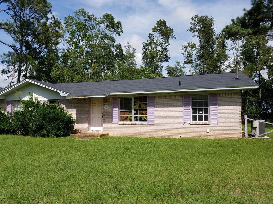 INVESTORS SPECIAL!  Just a few Renovations will make this a great home for Re-Sell or for Income Property.  Located on a paved road and less than 5 miles from the new Marianna Schools, this brick home is a great investment.  3 Bedrooms and 1.5 baths and an enclosed carport extra room, give it plenty of space for a family.  Large Patio on the back and a large lot on a paved road. This home won't last long. Call today to see.