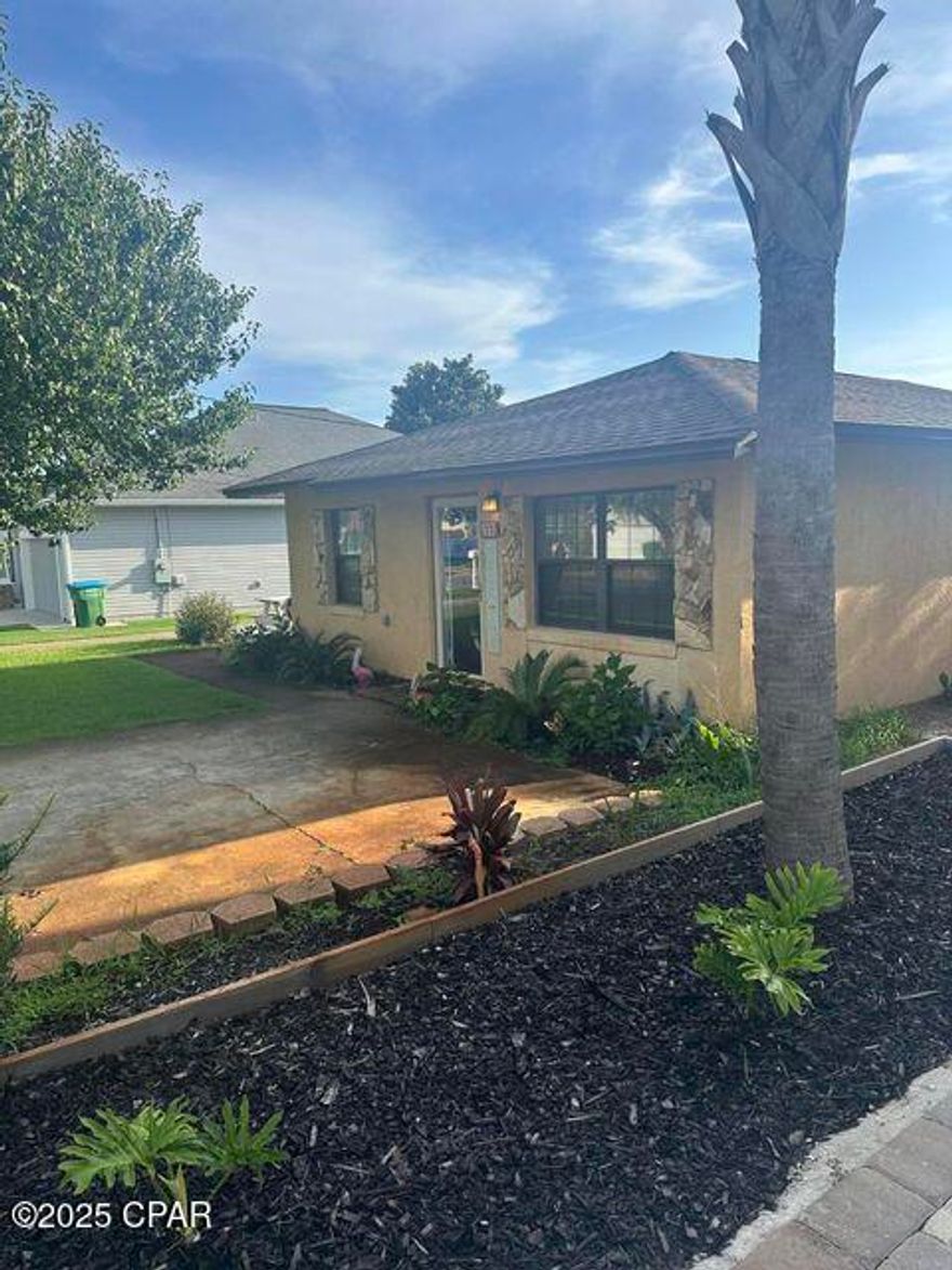 Welcome to the Beach!!  Located on the west end of PCB and less than 2,000 feet to the world's most beautiful beaches.  This home sits in one of the most sought out areas ont he beach.  Enjoy the convenience of great restaurants, shopping, entertainment, and a short drive to Pier Park or 30A.  This affordable home boasts 2 bedrooms, 2 full bathrooms in the main home and an efficiency detached above the garage.  Home has a large privacy fenced backyard you can enjoy summer gatherings with family and friends.  Enjoy the newly updated flooring, kitchen, and bathrooms.  If you're looking for the perfect investment, vacation home, or a permanent residence you must see this property.