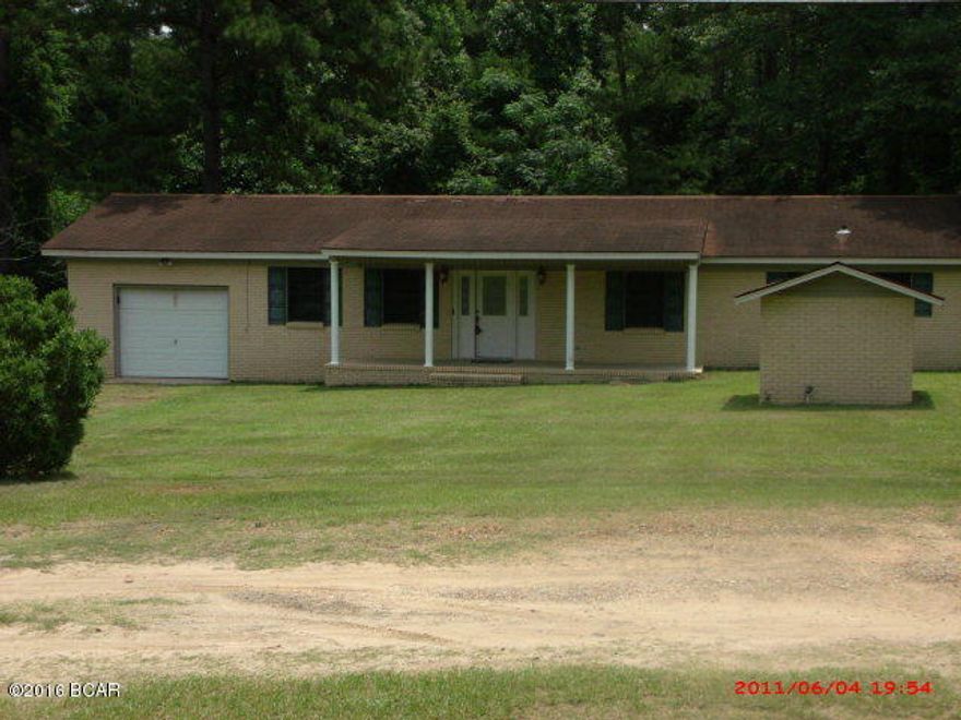 ***PRICE REDUCTION ON THIS MOVE-IN Ready home just minutes from shopping and schools in Marianna. This home features large living room with built-in surround sound, blinds and laminate wood flooring. TV wall mount will remain. Very nice eat in kitchen with sliding glass door to beautiful back yard. Bathrooms have been updated. Master bedroom features large walk-in closet. Outside is a 12X24 workshop with electrical outlets on every wall. There is a 16X20 pole barn for added storage. Huge grapefruit tree in back yard. Make an appointment today to see this one!