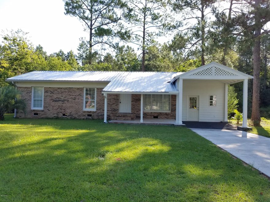 UPDATED home in Chipley city limits! 3 Bedroom 2 bath home with  Huge Family room that could also be used as a master bedroom making this a 4 bedroom home! The family room has an 8x15 sunroom or office area! French door leading to the wood decking in the partially fenced backyard where there is plenty of room for the kids to play!  The kitchen has new countertops, flat surface stovetop, farm style sink, tile backsplash & breakfast bar. Original refinished hardwood floors in the living room and bedrooms that are in good condition! New celling fans & doors in very room. New metal roof, concrete driveway. There is a workshop (converted garage) that also is air conditioned. Come take a look for yourself.