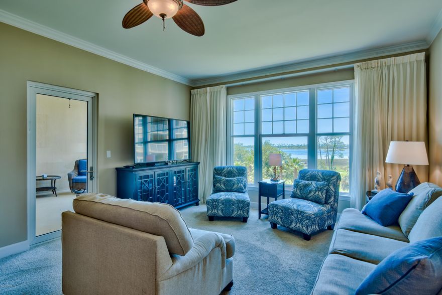 Experience the resort lifestyle at Reflections at Bay Point, whose luxury amenities include a 10,000-square-foot tropical pool, hot tub, salon and spa, on-site dining, tennis, championship golf, shopping, entertainment and the pearly white sands and emerald green gulf waters. From the comfort of your 4th floor, bay-front condo, you can enjoy year-round residency or create vacation memories, all while drawing a comfortable rental revenue stream. The property captures views of palm tree tops and St. Andrews Bay. The covered balcony can be accessed from the living room and master bedroom. It offers a ceiling fan, white columns and railing, and cozy furnishings for hours of relaxation. The kitchen has granite countertops, crisp white appliances and an inviting breakfast bar that loosely defines the dining space. The living room features a floor to ceiling sliding glass wall to the outdoor patio. Each bedroom has its own private bath, and bonus conveniences include a washer-dryer unit, living room sofa bed along with both carpet and tile floors. Fine workmanship includes lever door handles, panel doors, crown molding and natural daylight streaming into the living room and both bedrooms. Fully furnished and ready for adventurous new owners.