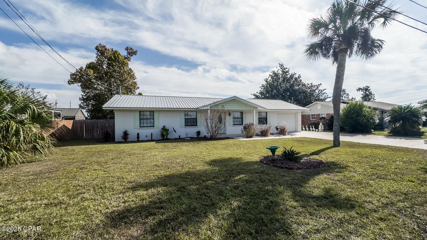 CURRENTLY UNDER CONTRACT, SELLER WILL CONSIDER BACKUP OFFERS. Nestled in a peaceful neighborhood just minutes from shopping, dining, beaches, and parks, this stunning pool home sits on an expansive lot and feels brand new from the moment you arrive. 
A beautifully landscaped front yard and welcoming covered porch set the tone for this completely modernized residence. Step inside to appreciate fresh paint, brand-new luxury vinyl plank flooring throughout, and sleek recessed lighting that brightens every room. A fully remodeled kitchen includes soft-close cabinetry, sparkling quartz countertops, upgraded stainless steel appliances, and serene views of the pool and backyard—perfect for morning coffee or entertaining. Both bathrooms have been tastefully updated with elegant granite vanities and luxurious tiled showers. The spacious primary suite overlooks the pool and features its own beautifully appointed en-suite bath with a walk-in tiled shower. Step outside to your private oasis: a sparkling pool surrounded by an oversized patio and palm trees with plenty of room for lounging and hosting friends. The backyard also includes a powered workshop complete with a fish-cleaning station and running water—ideal for hobbies, extra storage, or easily convertible into a poolside cabana or hangout spot. Additional highlights include a spacious garage with brand-new door and built-in storage, plus extended parking on the side of the home—perfect for a boat, RV, camper, or guests. Landscaping irrigation is fully functional and is Wi-Fi enabled. Homes like this rarely come along at this price. Don't wait—schedule your private showing today and make this dream home yours! No flood insurance required!