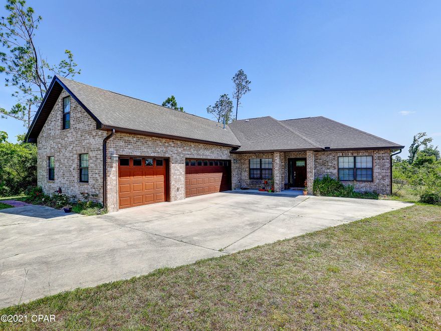 BEAUTIFULLY APPOINTED HOME IN THE HEART OF LYNN HAVEN HAS 4bedrooms/3bathrooms, large family room, plus a study. The bonus room above the 3 car garage has a full bath, that would make a great mother-in-law suite. There is lovely crown molding and deep baseboards, quartz and granite countertops and great custom cabinets throughout, by Creamer Cabinets. There is a divided 3 car garage, which makes it easy to turn one into a workshop, if desired. The home is next to a conservation area that will never be built on, giving you lots of privacy. Wonderful kitchen has tons of countertop space and cabinets for storage, double ovens, breakfast bar, new dishwasher, step-in pantry and a natural gas stove! The family room/den easily handles a big couch to enjoy movie nights as a family. The tiled showers have instant hot water since the installation of the tankless water heater! Age, rm size, sq ft, lot sizeare all estimates, so please measure if concerned