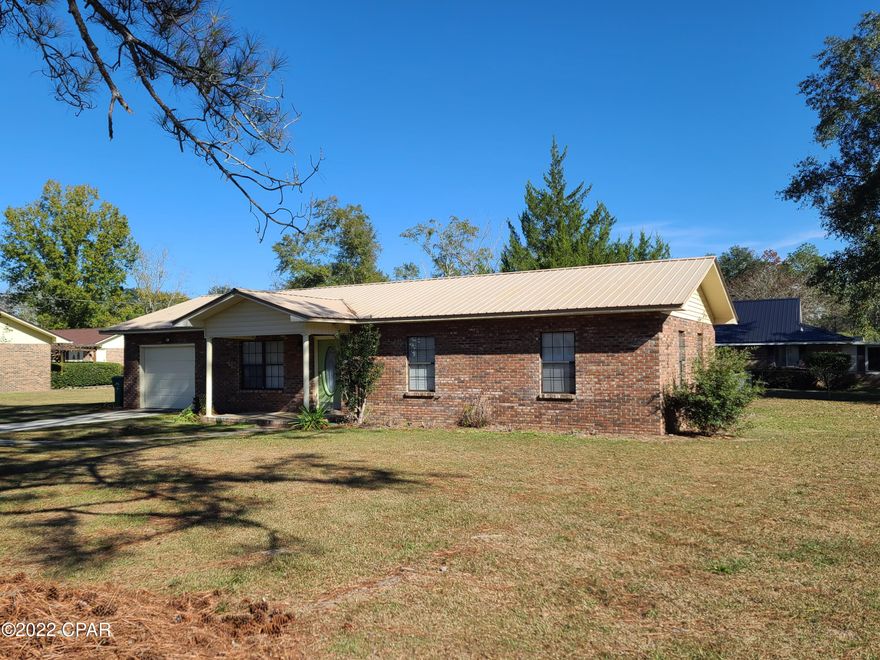This is the perfect starter home or for someone wanting to downsize.  It's located in a quiet neighborhood in Graceville with a fenced backyard for the kids or dogs to play in.  Inside is an open concept living, dining and kitchen.  The laundry room is large enough to accommodate washer, dryer and a freezer.  Don't miss this one!  It is a great find.