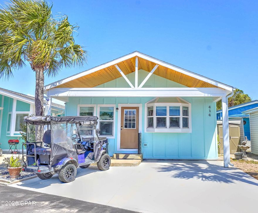 Welcome to your perfect beach getaway in the highly sought-after gated community of Venture Out in Panama City Beach. This beautifully updated 2 bedroom, 2 bathroom home offers the ideal blend of comfort, style, and coastal charm. Recent exterior upgrades include new Hardie siding, fresh paint, porch railings, giving the home a clean, modern look with long-lasting durability. Step inside to find a bright and inviting open-concept living space with durable flooring, coastal-inspired décor, and plenty of natural light. The spacious living room flows seamlessly into the dining area and well-appointed kitchen, featuring ample cabinetry, solid surface countertops, and a stylish backsplash--perfect for entertaining or relaxing after a day at the beach. Both bedrooms are generously sized, and with two full bathrooms, the layout is ideal for hosting guests or maximizing rental potential. The home is being offered fully furnished, making it truly turnkey for a second home, vacation rental, or full-time residence. Outside, enjoy a covered front porch and private parking, with plenty of room for your golf cart--your preferred way to get around this golf cart-friendly community. Venture Out is known for its unbeatable amenities, including private beach access, two swimming pools, tennis and pickleball courts, basketball, a fishing pier, marina, boat launch, playground, and 24/7 gated security. Ideally located between the Gulf of Mexico and Grand Lagoon, you're just a quick golf cart ride to the beach and minutes from local marinas, dining, and entertainment.  Whether you're looking for an investment property or your own slice of paradise, this move-in-ready home checks all the boxes. Schedule your private showing today and start living the beach life.