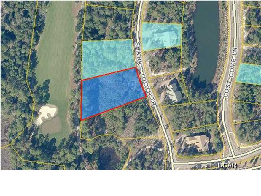 FORECLOSURE! Nice lot in Wild Heron that backs up to the golf course.Wild Heron is a gated community that features a community dock, playground, swimming pool, clubhouse and much more. Build your dream home today!
