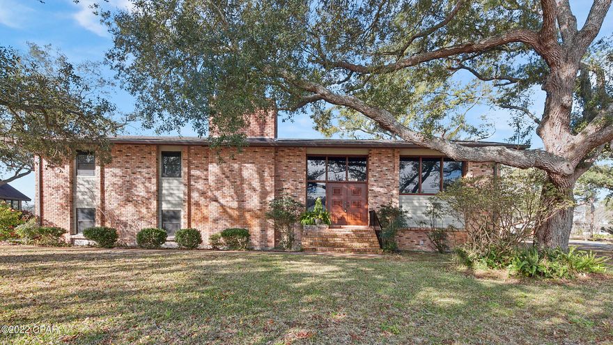 BEAUTIFUL, SPACIOUS HOME OVERLOOKING HENTZ POND - This newly remodeled 4-bedroom 3 bath brick home is as beautiful as it is roomy. Its sits on a 1/2-acre lot and its features include a new roof, new paint, new floors and an entirely new kitchen. Looking for an indoor children's play area, office, home theater, library, home gym or simply need room to entertain?  The generous second-floor bonus room will make any of those plans possible. Just off of the bonus room is the wet bar.  It includes a wine rack, refrigerator, sink, plenty of storage and overlooks beautiful Hentz Pond.  There are no small rooms in this home; two of the second-floor bedrooms have double closets and one has a window seat with a view of the mature oaks dotting the front yard. The tastefully designed kitchen includes butcher block countertops, a very large island, farm sink, soft-close cabinets and new stainless appliances. The family room has 18' ceilings and a floor to ceiling brick fireplace. The master bathroom has double vanity sinks and a walk-in closet with beautiful built-in shelving. The entire home reflects the Pretty Bayou Island standard of comfort and enjoyable living.  Measurements are approximate, buyer to verify if important.